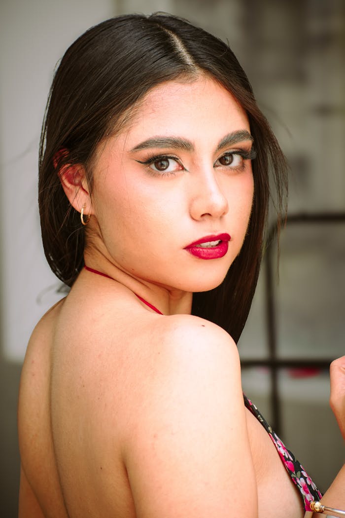 about-us Stunning portrait of a woman with bold makeup indoors in Mexico City.